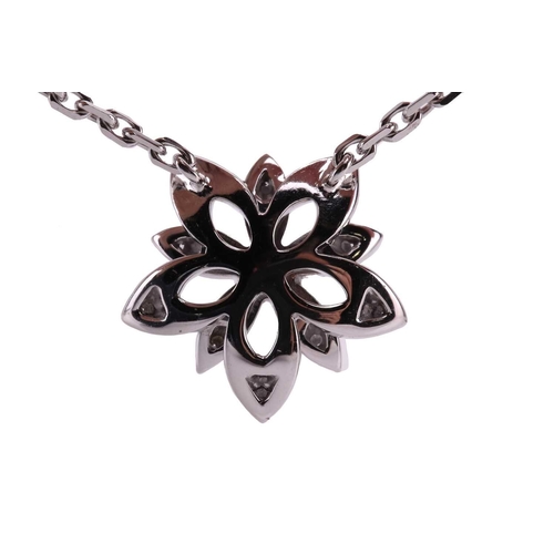 97 - Van Cleef & Arpels - a diamond-set lotus openwork pendant on chain, mini model, flowerhead motif set... 