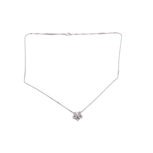 97 - Van Cleef & Arpels - a diamond-set lotus openwork pendant on chain, mini model, flowerhead motif set... 