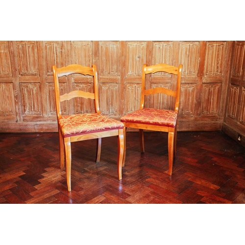 105 - A French fruitwood single carver chair, 104 cm high x 53 cm wide, together with six conforming dinin... 