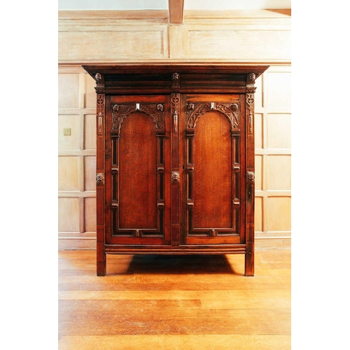 14 - An 18th-century Dutch oak Schrank, the moulded cornice above a pair of arched panel doors, accented ... 