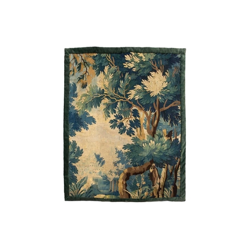 141 - A 17th-century Flemish verdure tapestry fragment, a woodland setting, later linen backed, 141 cm x 1... 