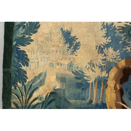 141 - A 17th-century Flemish verdure tapestry fragment, a woodland setting, later linen backed, 141 cm x 1... 