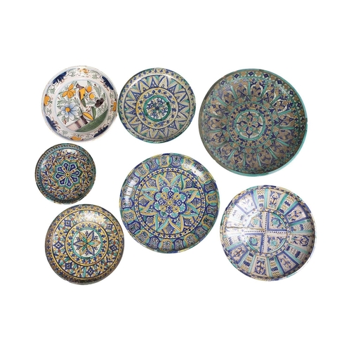 148 - An Eastern tin-glazed footed circular dish possibly Moroccan Fez late 19th/20th century, painted in ... 