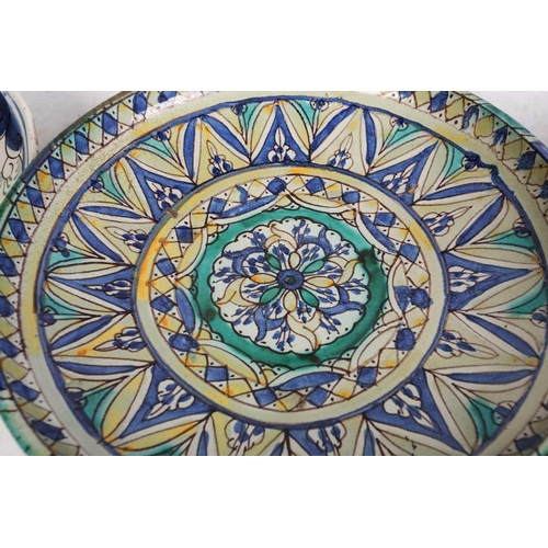 148 - An Eastern tin-glazed footed circular dish possibly Moroccan Fez late 19th/20th century, painted in ... 