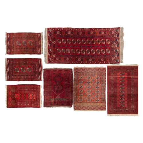 160 - An 'old country house' madder red Afghan prayer rug,110 cm x 83 cm, together with other Turkoman rug... 