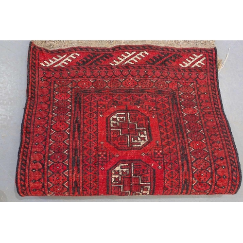 160 - An 'old country house' madder red Afghan prayer rug,110 cm x 83 cm, together with other Turkoman rug... 