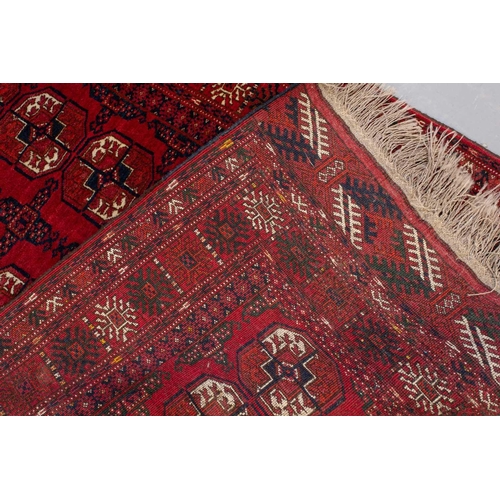 160 - An 'old country house' madder red Afghan prayer rug,110 cm x 83 cm, together with other Turkoman rug... 