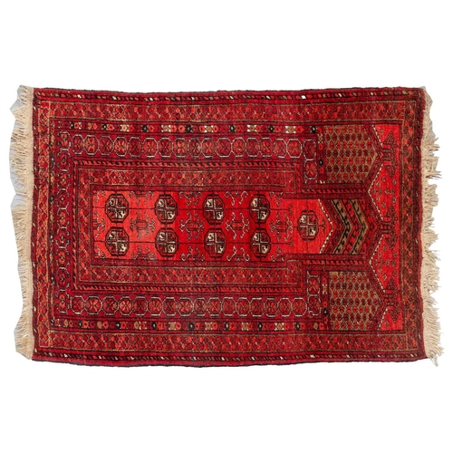 160 - An 'old country house' madder red Afghan prayer rug,110 cm x 83 cm, together with other Turkoman rug... 