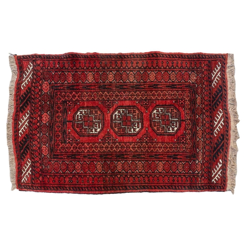 160 - An 'old country house' madder red Afghan prayer rug,110 cm x 83 cm, together with other Turkoman rug... 