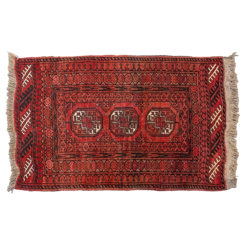 160 - An 'old country house' madder red Afghan prayer rug,110 cm x 83 cm, together with other Turkoman rug... 