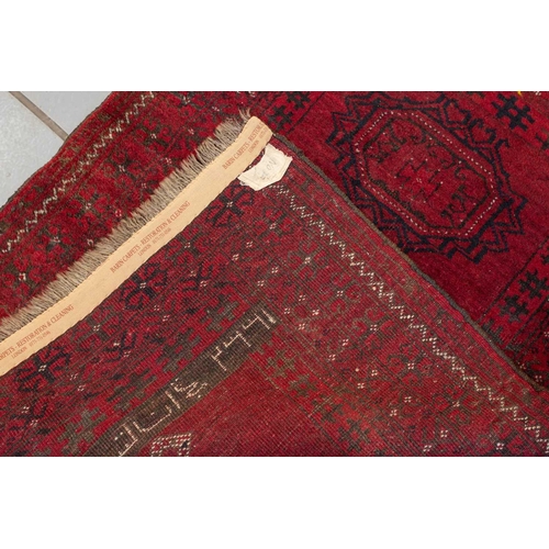 160 - An 'old country house' madder red Afghan prayer rug,110 cm x 83 cm, together with other Turkoman rug... 