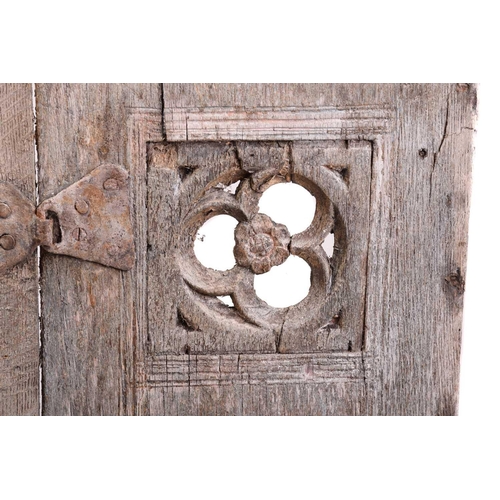 169 - A 19th century oak hanging cupboard, with twin panelled door enclosing shelves, 66 cm wide, 103 cm h... 