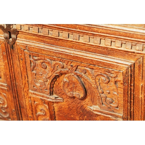 18 - A 17th-century Continental oak coffer, with dentil moulding above two carved arcade facade on later ... 