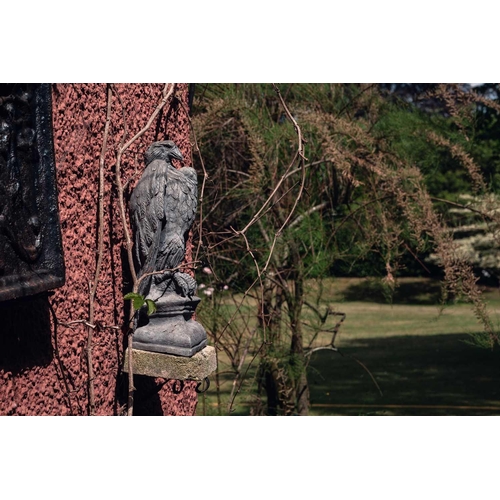 186 - A pair of lead based ornamental garden eagle, seated on plinths, 48 cm high and two rectangular galv... 