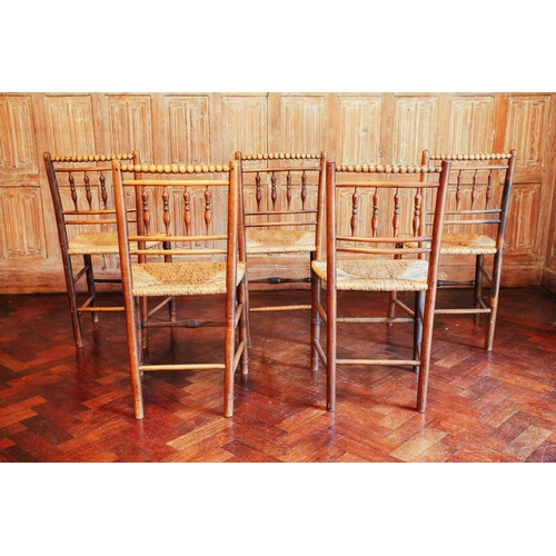 191 - A set of five Victorian ash and rush-seated chairs, the bobbin-turned top rails over spindle-turned ... 