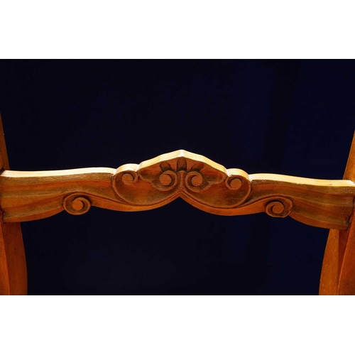 193 - A set of four continental Birchwood dining chairs. the shaped top rails over scroll carved mid-rails... 