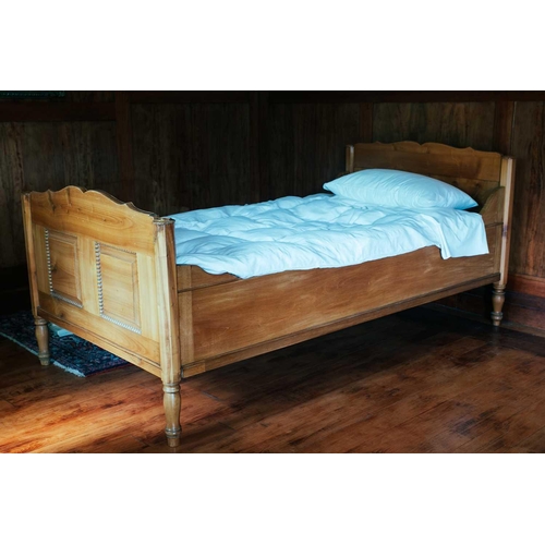 198 - A pair of French fruitwood single sleigh beds, 19th century and later adaptations with panelled ends... 