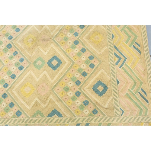 199 - A large 'Mid-Century Vintage' style needlework rug in geometric patterns with muted tones of ochre a... 