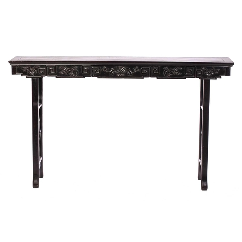 251 - A Chinese carved Hongmu (Rosewood) altar table, Qing Dynasty, 19th century, with a plain panelled to... 