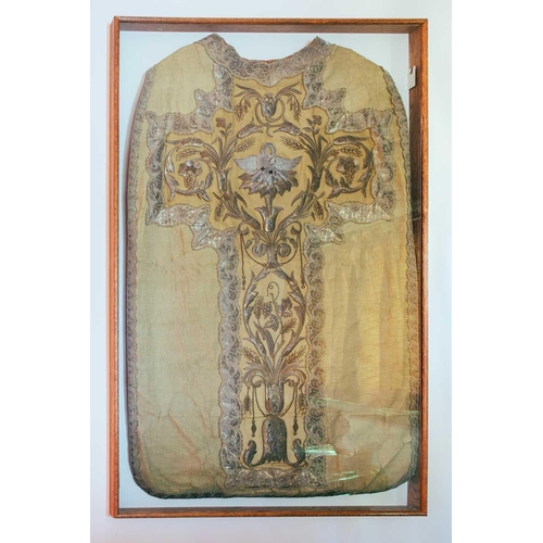 26 - A Continental priest's chasuble in thick fabric with silvered metal embroidered ornament, 110 cm x 6... 