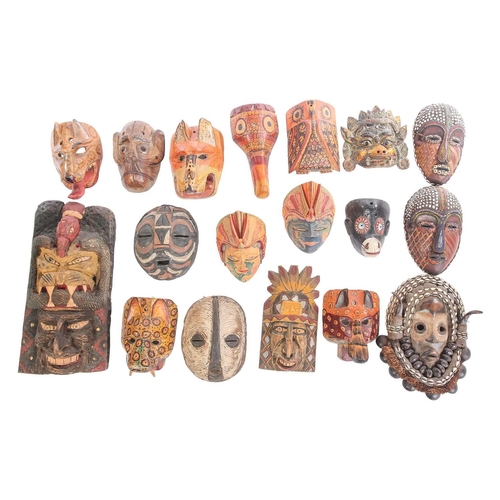 262 - A collection of sixteen polychrome carved wood face masks, from Guatemala, India, Africa and the Far... 