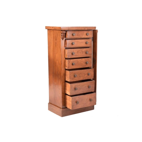 268 - A Victorian walnut Wellington chest of seven short drawers secured with a single hinged register bar... 