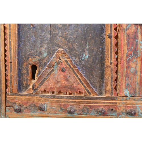 273 - A painted softwood Morrocan Door, of panelled construction with metal studs, the arched and serrated... 