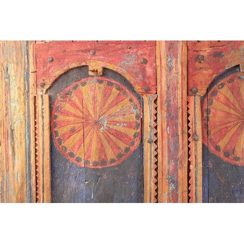 273 - A painted softwood Morrocan Door, of panelled construction with metal studs, the arched and serrated... 