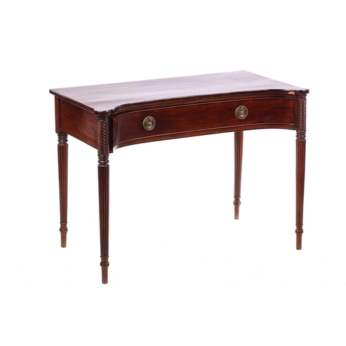 274 - A Regency style mahogany concave front side table, the top with rounded corners over a frieze drawer... 