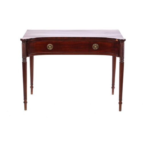 274 - A Regency style mahogany concave front side table, the top with rounded corners over a frieze drawer... 