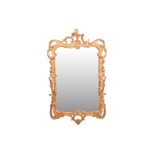 279 - A pair of George II style giltwood wall mirrors, the rectangular plates within frames with floral su... 