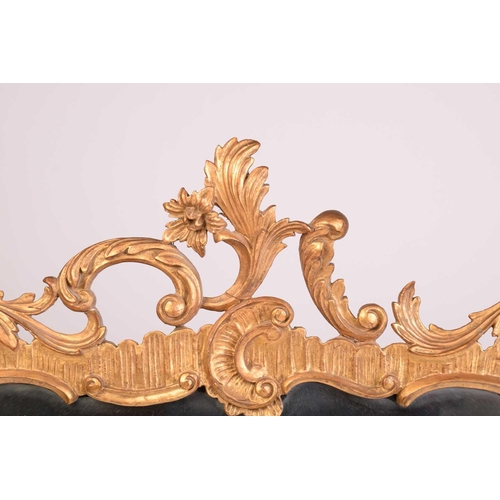 279 - A pair of George II style giltwood wall mirrors, the rectangular plates within frames with floral su... 