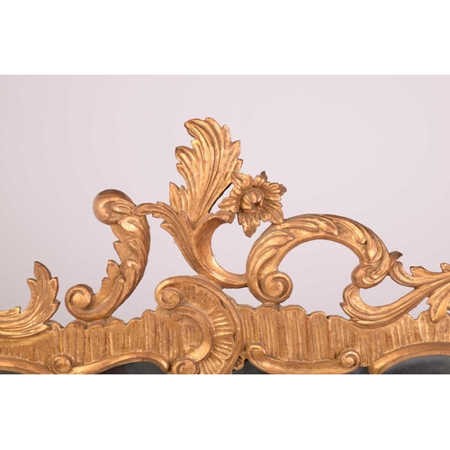 279 - A pair of George II style giltwood wall mirrors, the rectangular plates within frames with floral su... 