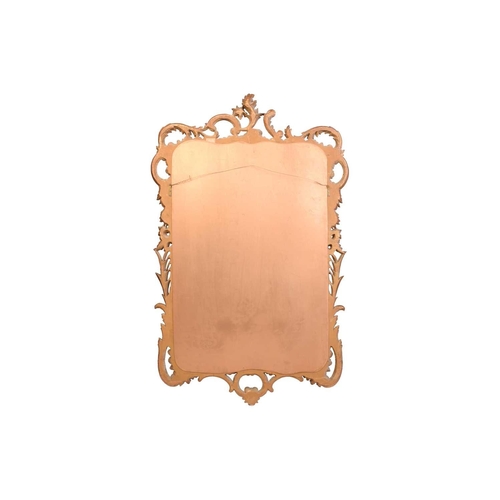 279 - A pair of George II style giltwood wall mirrors, the rectangular plates within frames with floral su... 