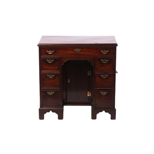 280 - An 18th-century mahogany knee-hole writing desk fitted with a central frieze drawer above a further ... 