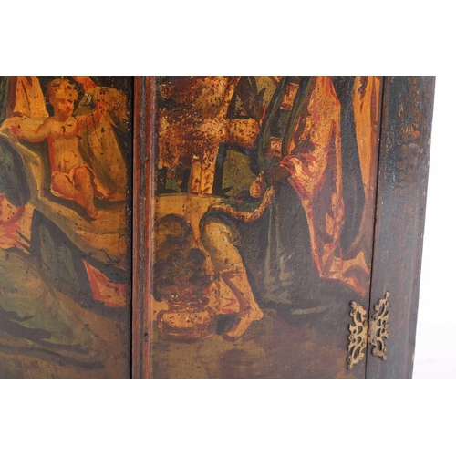 285 - A 19th century painted wood hanging corner cupboard, the twin doors depicting the Wise Men before th... 