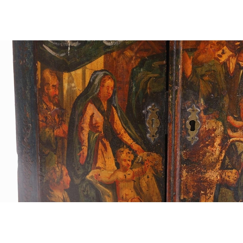 285 - A 19th century painted wood hanging corner cupboard, the twin doors depicting the Wise Men before th... 