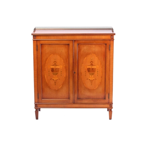 286 - A reproduction George III style mahogany side cabinet, the pierced brass half gallery over a pair of... 