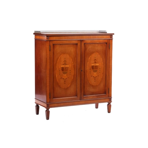 286 - A reproduction George III style mahogany side cabinet, the pierced brass half gallery over a pair of... 