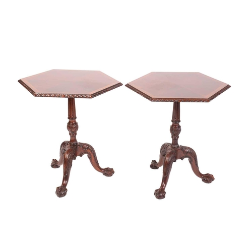 292 - A pair of George III style carved mahogany hexagonal pillar tables, 20th century, with crossbanded a... 