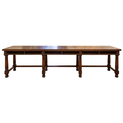 293 - A large 18th-century-style rectangular oak library directory table, with a planked top with moulded ... 