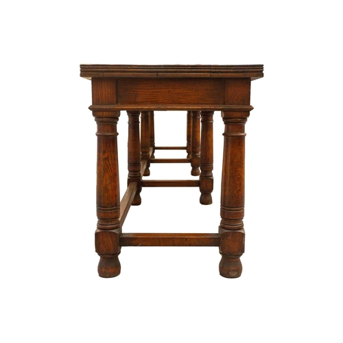 293 - A large 18th-century-style rectangular oak library directory table, with a planked top with moulded ... 