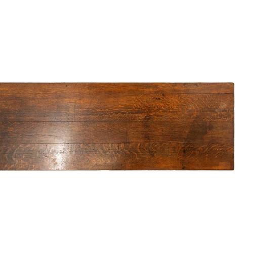 293 - A large 18th-century-style rectangular oak library directory table, with a planked top with moulded ... 