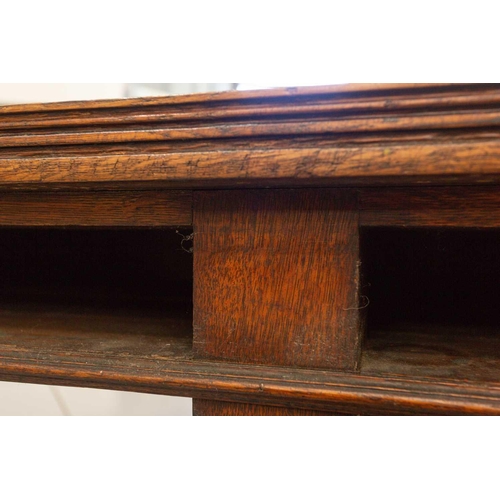 293 - A large 18th-century-style rectangular oak library directory table, with a planked top with moulded ... 