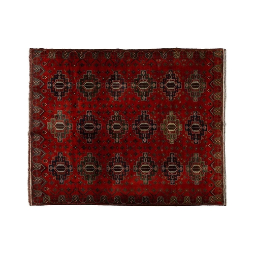 297 - A large dark red ground Turkomen-style carpet, 20th century with cruciform guls within geometric bor... 