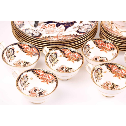 326 - A large collection of Royal Crown Derby 'Old Imari' items, to include plates, cups and saucers, milk... 