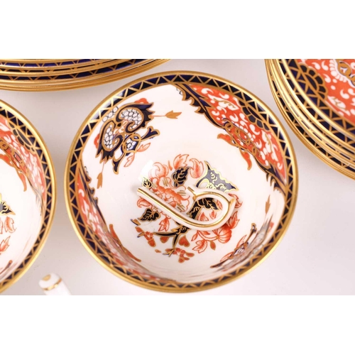 326 - A large collection of Royal Crown Derby 'Old Imari' items, to include plates, cups and saucers, milk... 