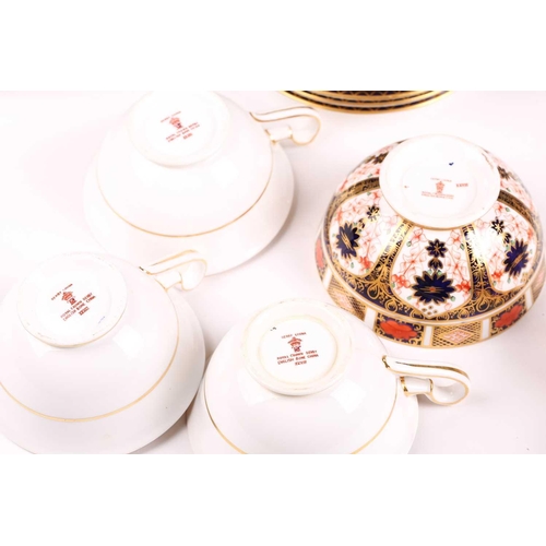 326 - A large collection of Royal Crown Derby 'Old Imari' items, to include plates, cups and saucers, milk... 