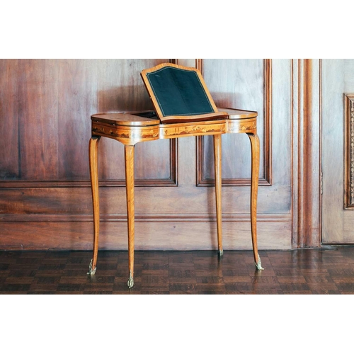 33 - A Louis XVI style parquetry inlaid lady's writing desk, 19th century, the central ratchet writing sl... 