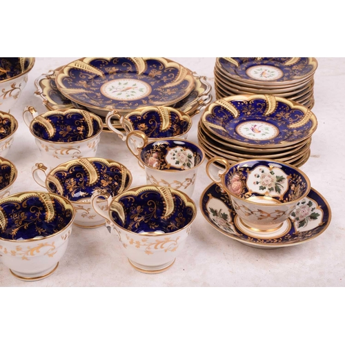 331 - An early 19th-century porcelain tea service, in the manner of Derby or Coalport, with exotic bird an... 